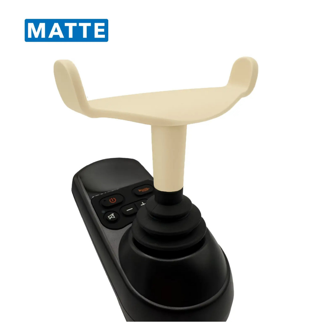 The ComfyGo Ergonomic U-Shaped Joystick Handle with Flex Shaft for Powerchairs is a black handheld remote featuring orange and black buttons, an ergonomic beige U-shaped top, and MATTE displayed in a blue box on the upper left corner.